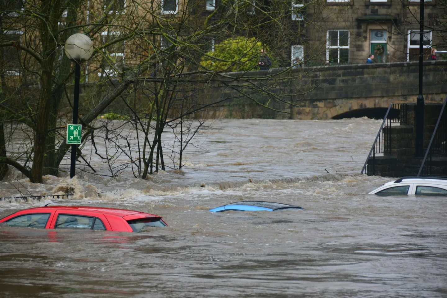 Flooded Dallas–Fort Worth street with rising water after a severe storm