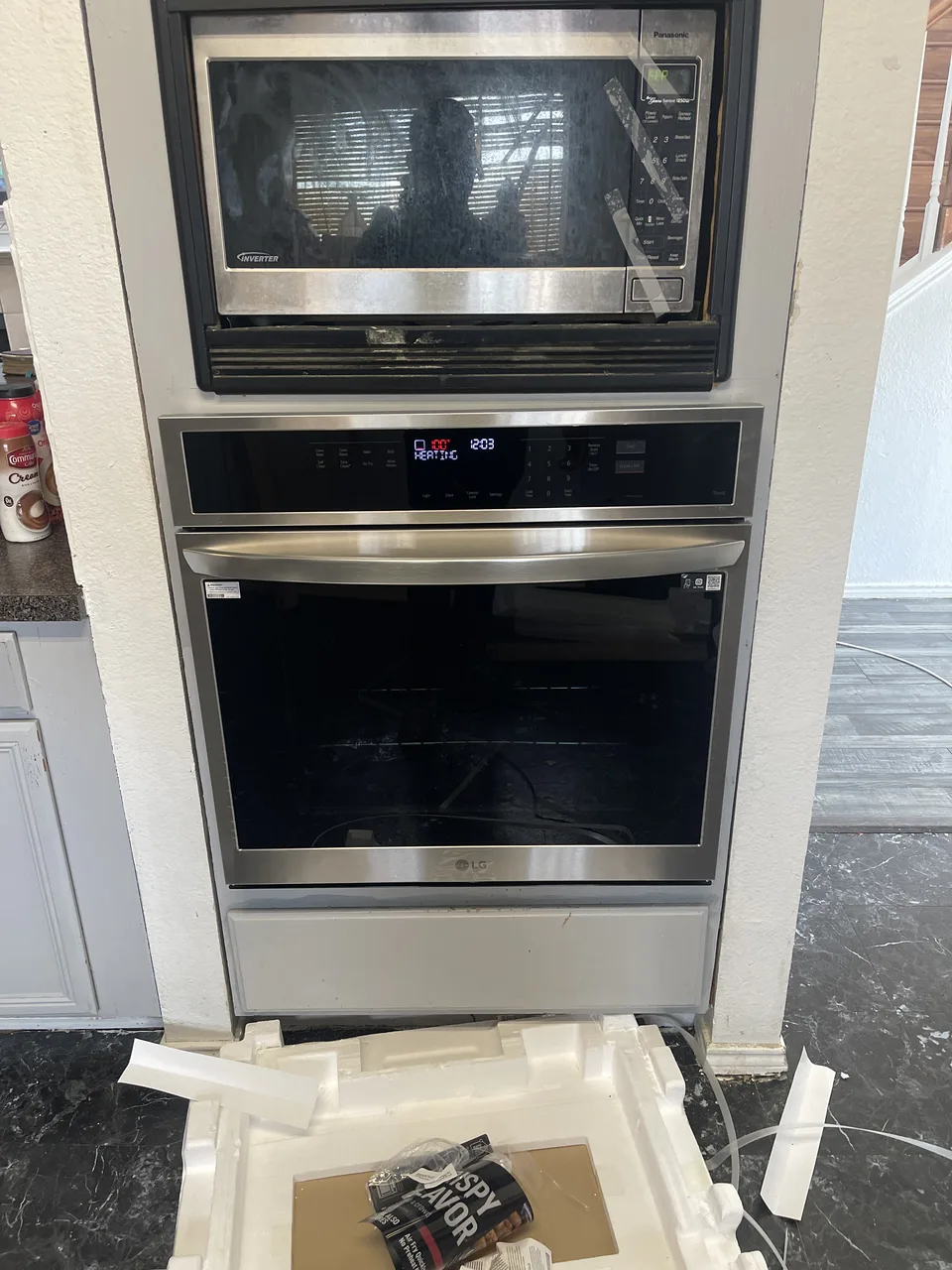 Installed wall oven and microwave documented during kitchen reconstruction